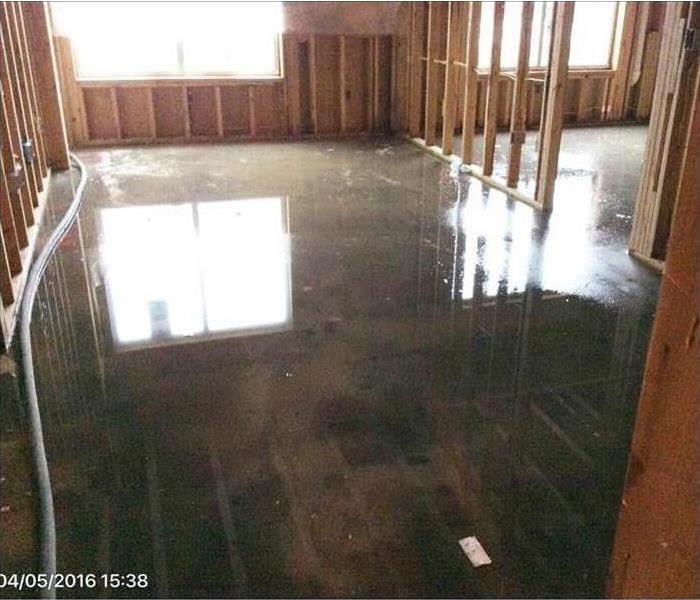 Standing water on a concrete floor. 